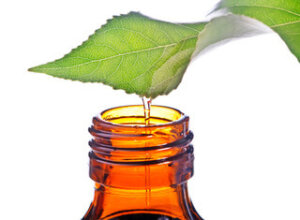 bottle with homeopathy balm and leaf