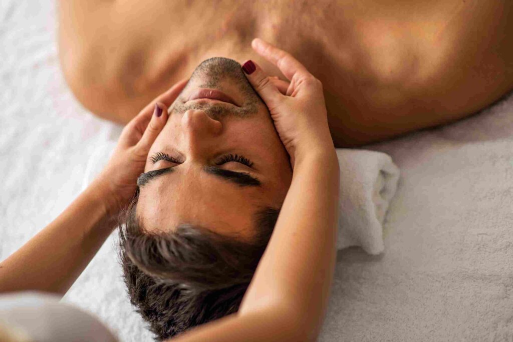 man getting aroma facial massage